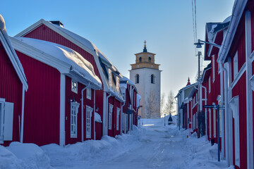Rows with red huts in Gammelstad church town located near the Swedish town Lulea.