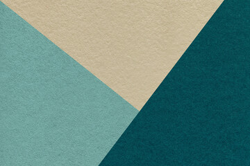 Texture of craft beige, cyan and teal shade color paper background, macro. Vintage abstract blue...