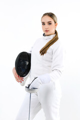 Portrait of a girl in a fencing costume with a mask and a sword