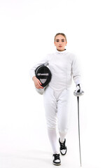 Portrait of young female fencer on white background