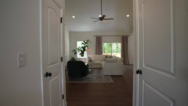 Walking through a modern American suburban home, entering through the front door, moving through the open concept living room