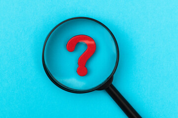 Look at the question mark with a magnifying glass