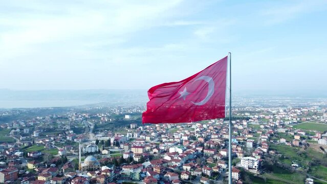 Turkish flag on top of the mountain. Turkish flag at the top with beautiful view. Turkish National holidays. 23 Nisan, 19 Mayis, 30 Agustos, 29 Ekim concept. Drone view. Aerial cinematic shot.