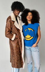 Portrait of african american couple wear stylish  90s fashion clothes with afro hairstyle isolated on gray background - 583843655
