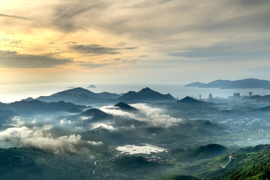 Panoramic photo of dawn viewed from the high mountains, in the distance is the famous coastal tourist city of Nha Trang