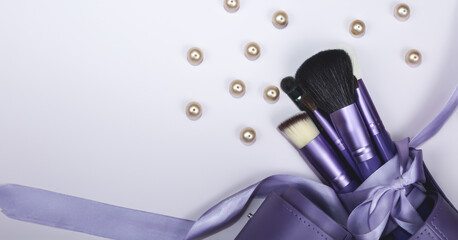 beauty makeup product layout. Fashion woman makeup brushes on light color background. Stylish design background. Creative fashion concept. Cosmetics makeup brushes collection, top view, banner