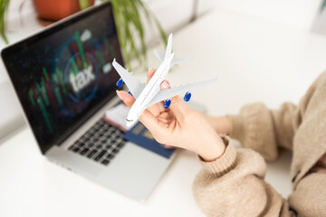International business and strategy concept. Laptop with toy plane