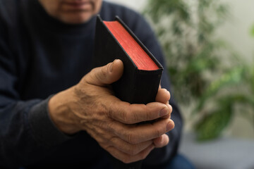 Hands of man praying to god with the bible, Concept of faith for god