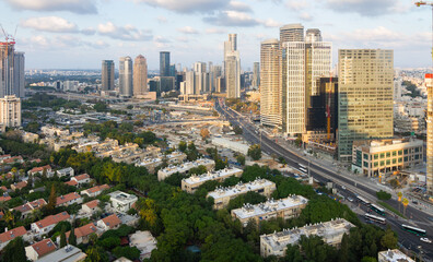 Tel Aviv-Yafo, Israel - September 23, 2020: Tel Aviv and Ramat Gan aerial view. Green dormitory quaters and modern skyscrapers