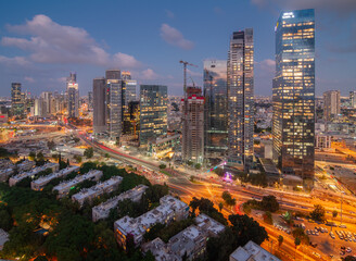 Tel Aviv-Yafo, Israel - September 23, 2020: Tel Aviv aerial night view. Modern skyscrapers and green dormitory quaters