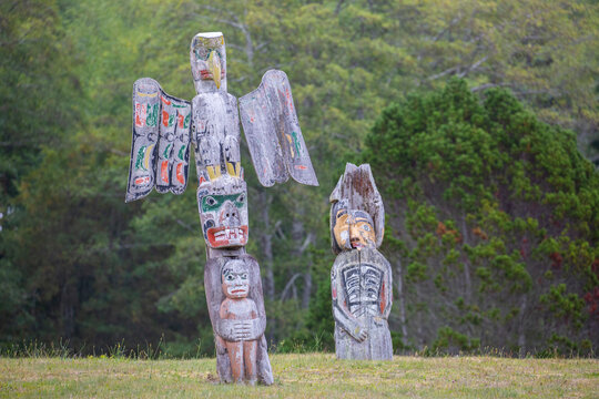 Kwakwaka'wakw totem poles in the cemetery in Alert Bay, Cormorant Island, British Columba, Canada