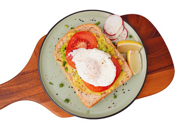 Breakfast, avocado on wholemeal bread and boiled egg on white background