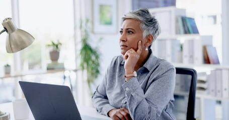 Senior woman, laptop and office with thinking, ideas and brainstorming for worry, trouble or planning. Serious indian executive, problem solving and computer with debt, financial strategy and stress