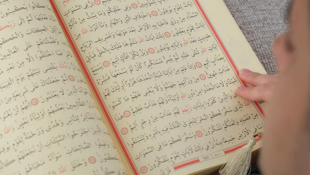 person reading Quran
