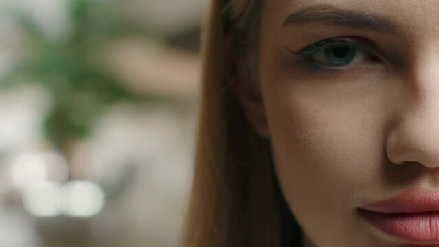Close up Caucasian woman girl half face perfect smooth skin. European female lady opening eyes beauty skincare natural makeup open eye vision health care ophthalmology. Cropped shot empty copy space