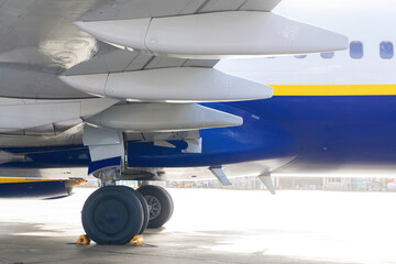 White-blue-yellow plane before takeoff