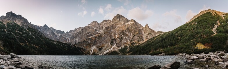 Panorama of Morskie Oko. Lake in mountains. Morskie Oko (Sea Eye) Lake is the most popular place in High Tatra Mountains, Poland. - obrazy, fototapety, plakaty