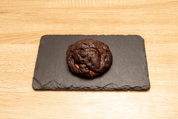 The traditional cookie recipe combines a dough made from butter and brown or white sugar with semi-sweet chocolate chips