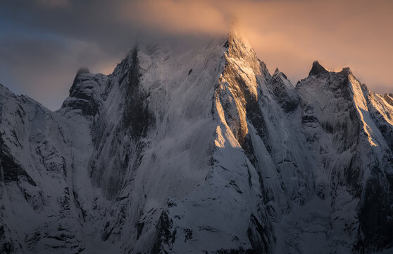 North and north-west faces of impressive and iconic granite wall in Swiss Alps, Pizzo Badile, Switzerland