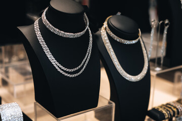 White gold jewelry, necklace on the showcase of women's accessories store