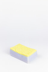 Sponge for washing dishes on a white background. Cleaning concept.