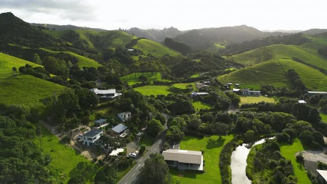 aerial scenic natural landscape footage of green hills scenario in New Zealand Ngunguru, north island