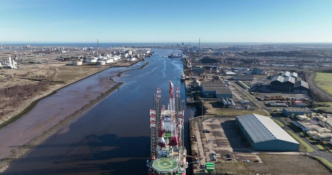 River Tees jack up vessels on berth offshore wind support, Leviathan and Seajacks Hydra - March 2023 - Aerial drone prores footage pull back with elevation - clip 2
