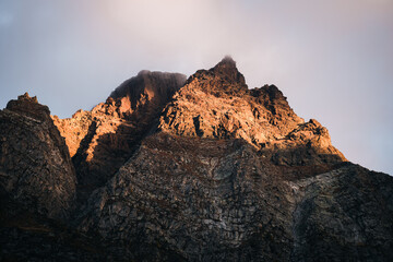 The sunrise appears with beautiful orange tones over the peaks of the mountains of Alpe Devero, Northern Italy