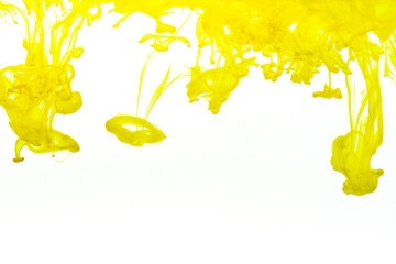 Abstract background picture with yellow ink dissolving in water	
