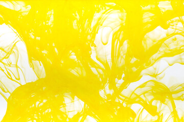 Abstract background picture with yellow ink dissolving in water	
