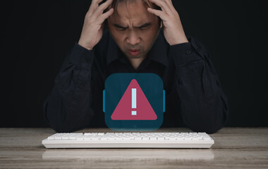 Businessman , developer staff or programmer holding his head and feeling bad after laptop error due...