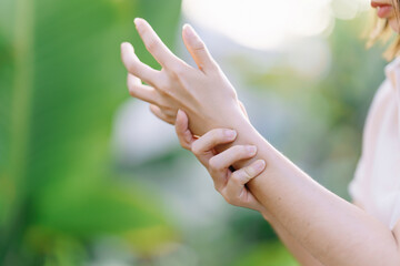 Woman having wrist pain due to carpal tunnel syndrome. Health care concept.