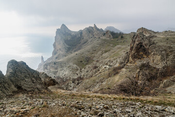 Devil's fireplace rock and bizarre rocks in Dead city. Khoba-Tele Ridge of Karadag Reserve in spring. Crimea