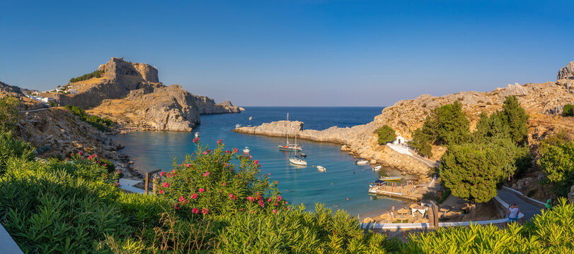View of sailboats in the bay, Lindos and Lindos Acropolis from elevated position, Lindos, Rhodes, Dodecanese Island Group, Greek Islands