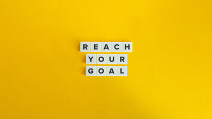 Reach Your Goal Phrase on Letter Tiles on Yellow Background. Minimal Aesthetics. - obrazy, fototapety, plakaty