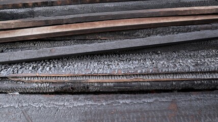 portrait of a pile of burnt wood