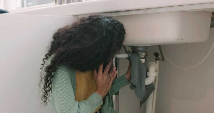 Sink repair, plumbing and woman on a phone call for maintenance, plumber service and home construction. Communication, manual labour and girl calling handyman for faucet problem, leak or kitchen pipe