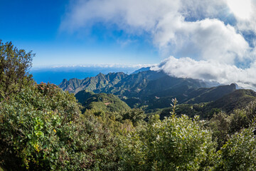 Aerial view of the national park of Anaga in Tenerife Canary Islands - Clouds rolling over beautiful mountain landscape	