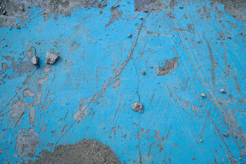 Blue paint surface with many scratches