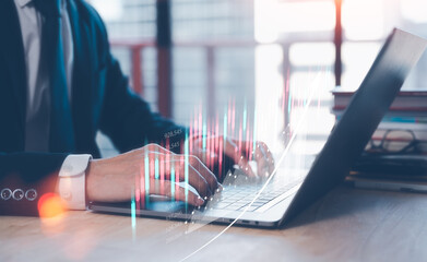 investment and financial strategy concept, trader marketing analysing stock market data, businessman working on computer laptop in office blurred background