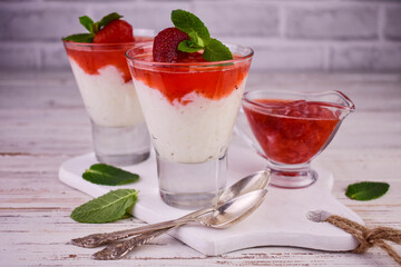 Delicate rice pudding with strawberry jam.	