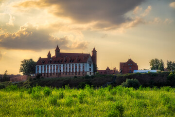 Fototapeta na wymiar The Castle of the Teutonic Knights in Gniew at sunrise. Built in the 14th century and located near the Vistula River in Pomeranian Voivodeship, Poland
