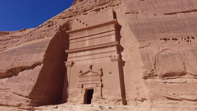 Al Ula - Saudi Arabia: The famous tombs of the Nabatean civilization, Al-Ula being their second largest city after Petra, at the Madain Saleh site in the Saudi desert. Shot with a tilt down motion