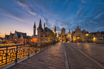 Ghent Belgium, city skyline night at St Michael's Bridge (Sint-Michielsbrug) with Leie River and Korenlei
