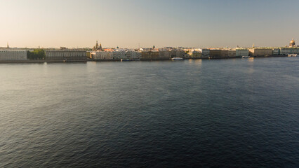 Fototapeta premium Aerial view above water of the Peter-Pavel's Fortress next to bridges on the river and water channel in the historical centre of city of St. Petersburg at sunny summer morning