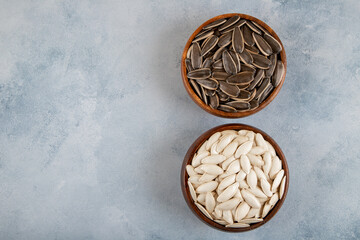Pumpkin seeds with sunflower seeds in bowl,top view
