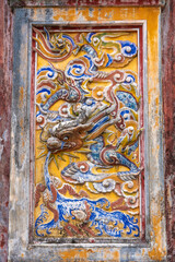 Vietnam, city of Hue, inside the ancient Imperial City. Detail on the facade of  Mieu Temple (Thế Tổ Miếu)
