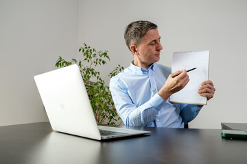 Man work with laptop in office.