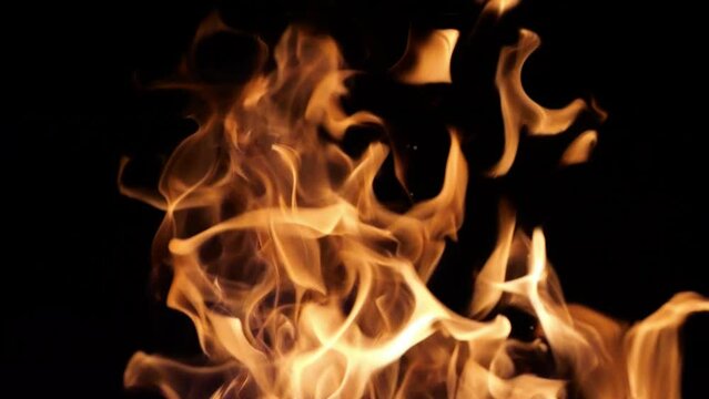 Flames of fire flicker on a black background. Fire hazard. Testura fire.