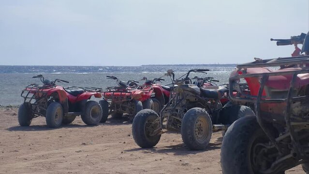 atv by the sea, red ATVs stand by the sea, ride ATVs by the sea, red sea, atv safari